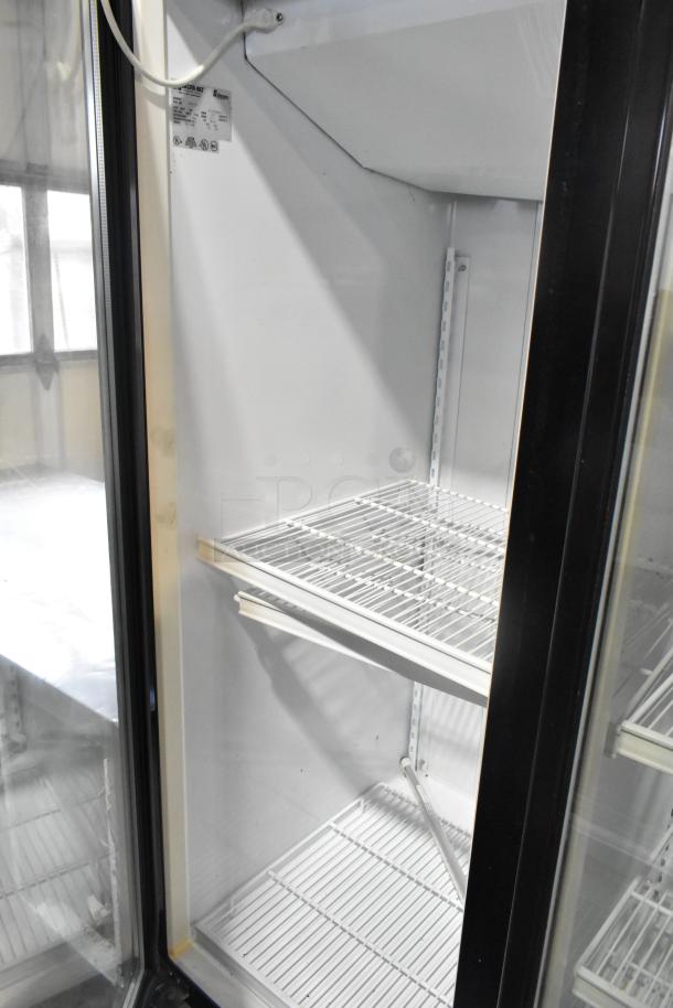 Master-Bilt BLG-74HD commercial 3-door freezer with poly coated racks, clean interior, metal finish, label details model and voltage.