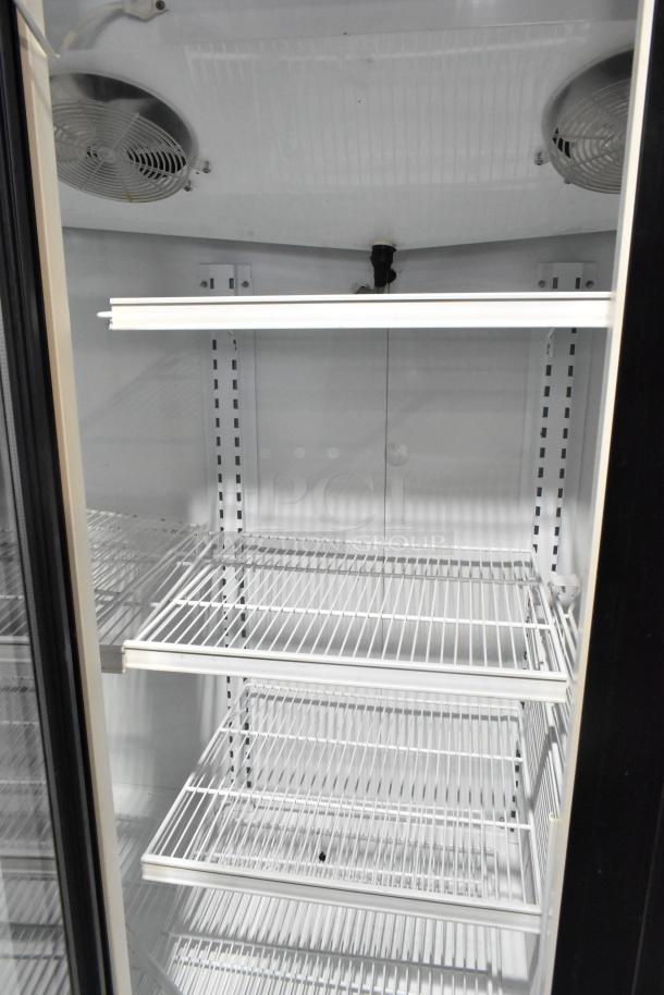 Master-Bilt BLG-74HD 3-door commercial freezer with white poly coated racks, 115/208-230 Volts, 1 Phase. Clean condition.