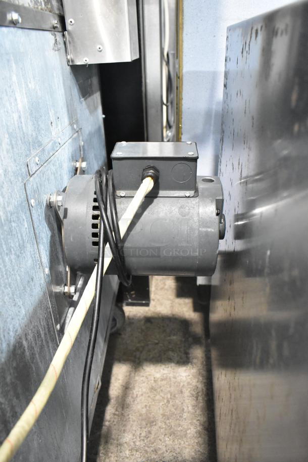 L&J NY stainless steel commercial convection oven, full size, view-through doors, metal racks, thermostatic controls, on casters.