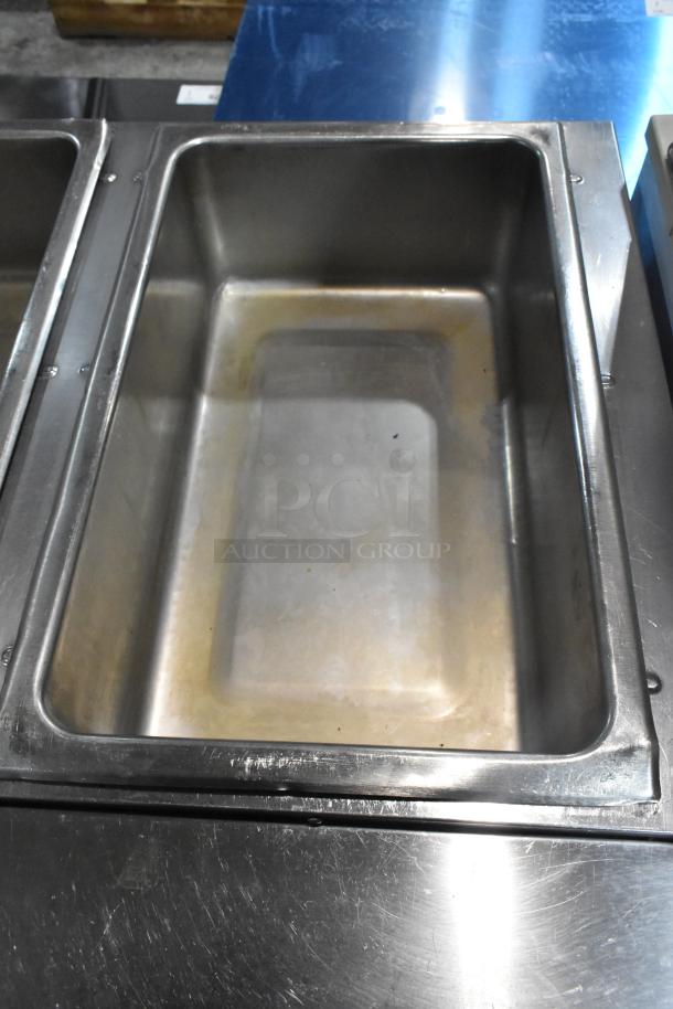 Eagle stainless steel commercial 3 bay steam table with metal under shelf, showing a clean, durable compartment.