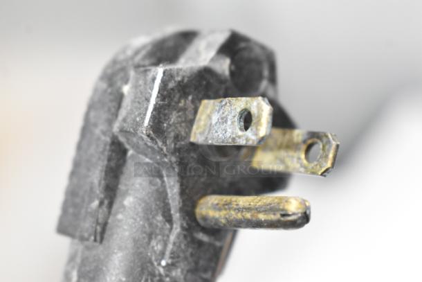 Close-up of a plug on a Kelvinator Metal Commercial Ice Cream Dipping Cabinet, 115 volts, 1 phase.