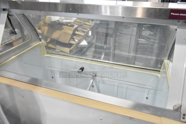 Kelvinator metal ice cream dipping cabinet, 115 volts, 1 phase, glass top, stainless steel trim, commercial-grade.