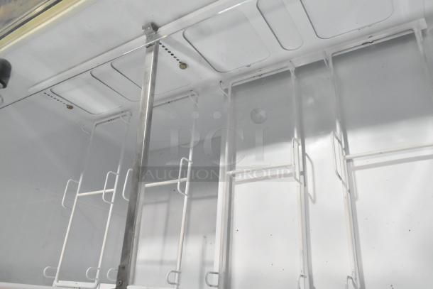 Kelvinator metal commercial ice cream dipping cabinet interior, white racks, durable metal construction, 115 volts, 1 phase.