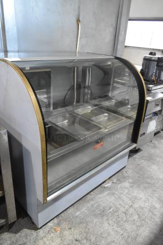 Marc Metal Commercial Heated Display Case Merchandiser with glass front, multiple trays, and "Caution Hot" label. Signs of use.