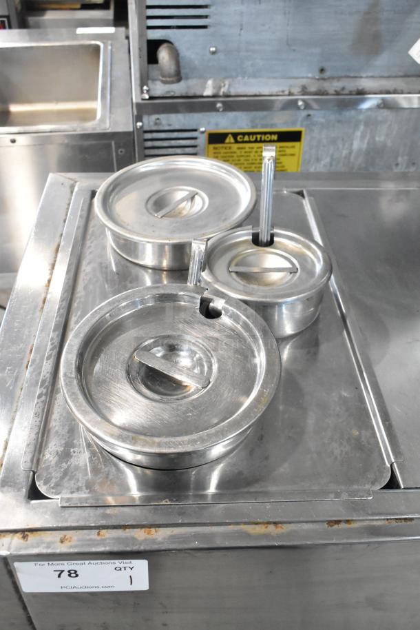 Stainless Steel Commercial 2 Well Steam Table with cylindrical drop-in bins, lightly used, includes lids and caution label.