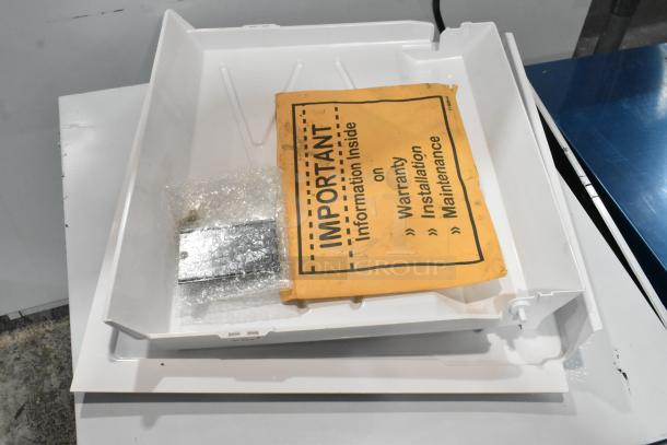 Stainless steel Scotsman MC0522SW-32A ice machine, new scratch and dent, warranty info visible, 480 lb. capacity.