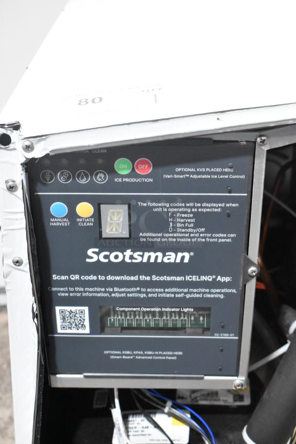 2024 Scotsman MC0522SW-32A ice machine control panel. Features blue and yellow buttons, QR code, and status indicators.