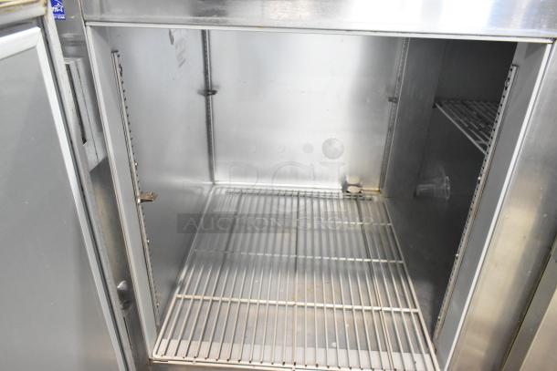 Beverage Air UCR67A stainless steel 2-door undercounter cooler, commercial casters, 115V, 1 phase, open interior view.
