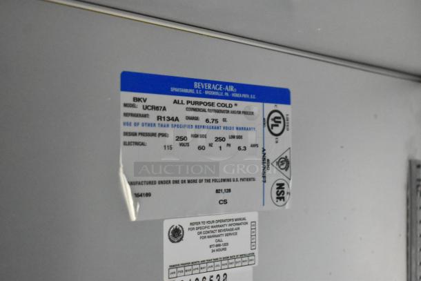 Beverage Air UCR67A stainless steel undercounter cooler, 2-door, 115V, 1 phase, on casters. Label shows model and specs.