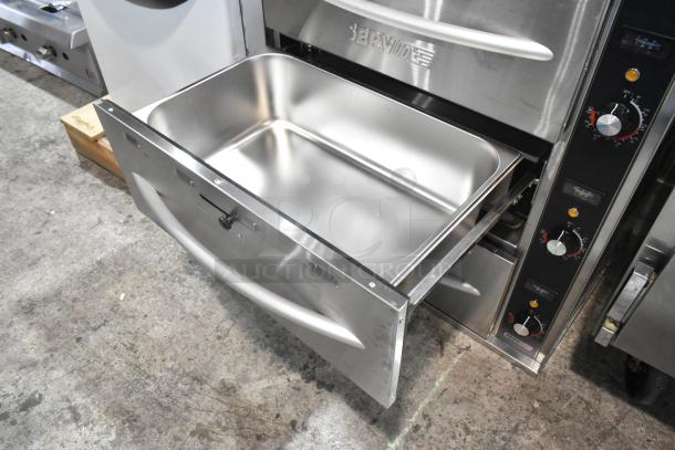 Brand new 2024 ServIt 423WDSFS3 stainless steel triple drawer warmer, 120V, 1 phase, visible dials, minor scratches.