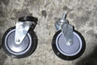 Brand new Regency 5" poly fixed and swivel casters, ideal for 6.3/8.5 cu. ft. shopping carts, two items included.