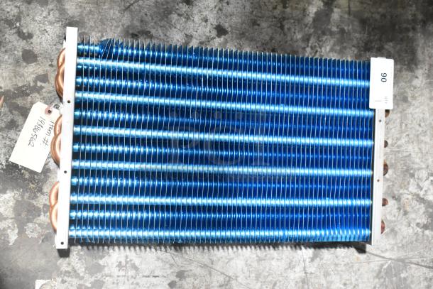 Brand new Avantco 19386562 evaporator coil for VAC-36W and VAC-36B, with minor scratches and dents, visible tags.
