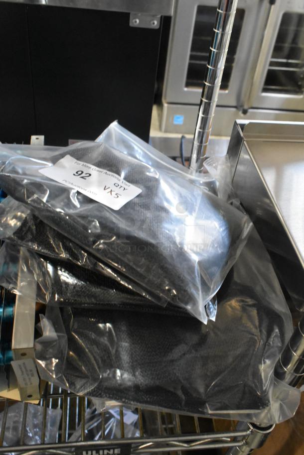 Five brand new items including Lavex 9 Qt. vacuum bags and Choice non-slip cutting board liners, sealed in plastic, labeled with auction details.