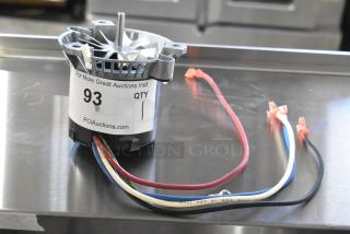 BRAND NEW SCRATCH AND DENT Fasco 71218459 Motor, 115/208-230V, 1 Phase, visible wires. Auction tag reads "93 QTY 1".