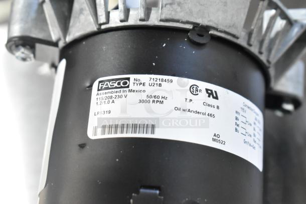 Brand new Fasco motor 71218459, 115/208-230V, 1 phase, 3000 RPM, scratch and dent condition, labeled parts included.
