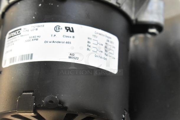 Brand new Fasco 71218459 motor, 115/208-230V, 1 phase, with visible scratch and dent, label indicates 3000 RPM.
