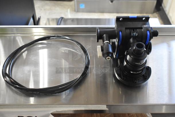 Bunn filter head, brand new, includes attached tubing, "OUT" label visible, condition: scratch and dent.
