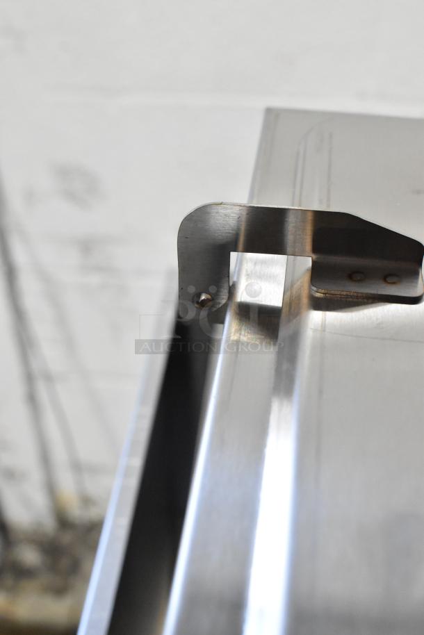 Stainless steel edge of the Carnival King 382CDPW3 Triple Cone Dip Warmer, close-up showing construction detail.