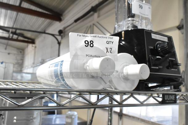 2 Bunn Easy Clear WEQ-25 water filter cartridges, new, slight cosmetic scratches, on metal shelf, 2 times bid offer.