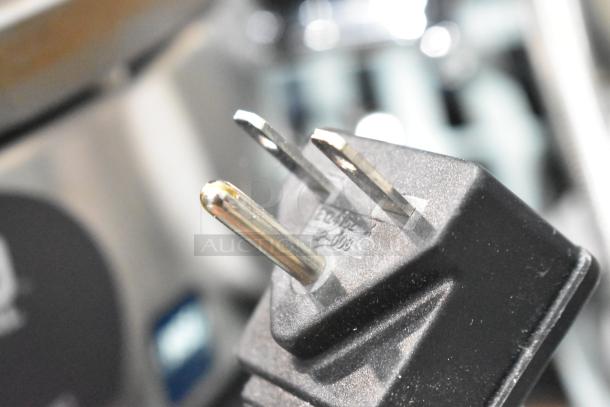 Close-up of plug for Waring WSC165B 16" Crepe Maker, 208/240V, new with minor scratches and dents.