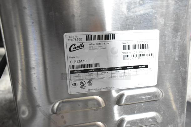 Curtis TLP12A19 automatic airpot brewer with hot water dispenser, brand new, stainless steel, 120V, 1 phase. Serial# 15078650.