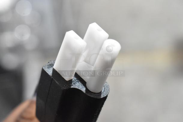 Close-up of a three-prong plug for Avantco 177MIX8GY mixer. Black and white design, focus on plug prongs.