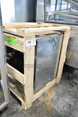 Brand new 2025 Naks SF7 10" belt drive supply fan with intake hood, in crate. Model: SF7, includes intake hood, auction tag visible.