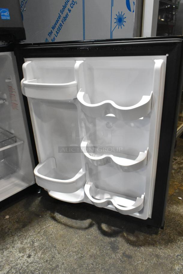 Micro Fridge 3.1MF7RS Mini Cooler, 115V, 1 Phase. Interior view of door with multiple white storage shelves.