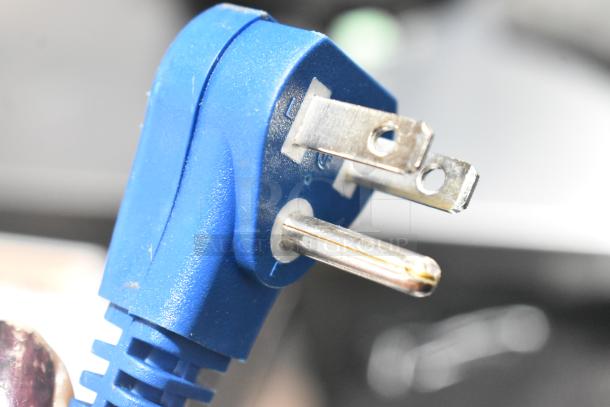 Close-up of a blue electrical plug for the Micro Fridge 3.1MF7RS Mini Cooler, 115 Volts, 1 Phase.