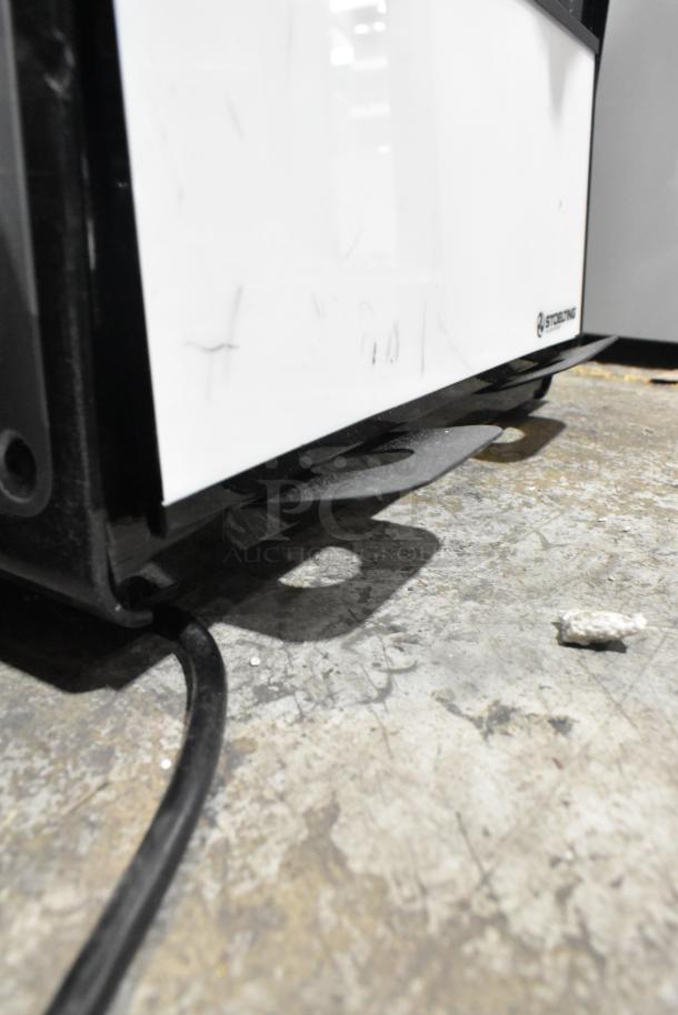 Brand new Stoelting SCBF128-37 metal commercial frozen beverage machine base, subtly marked, with visible power cable.