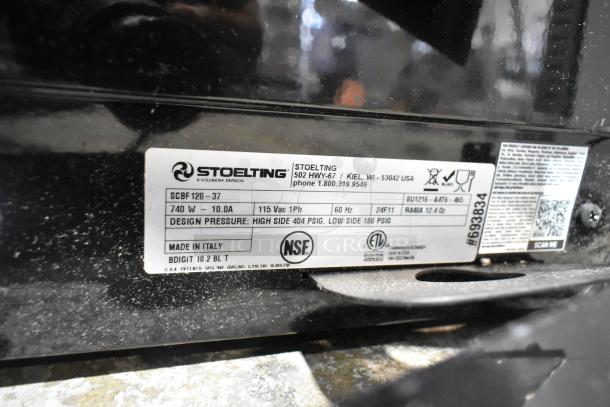 Brand new Stoelting SCBF128-37 metal commercial frozen beverage machine label shows model, voltage, and certification marks.