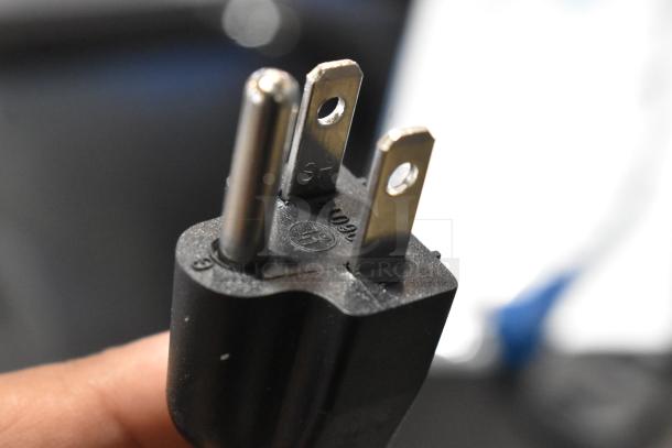 Close-up of a three-prong plug labeled "SP", "12", and "C/09" for the Hualian FS-200M impulse sealer, 110 volts.