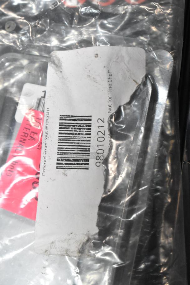 New-in-crate items: Bron Coucke blade 98010212, Amana LED lamp, Estella lubricating oil, Lavex vacuum brush roll.
