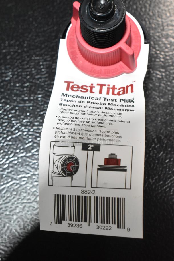 10 Sioux Chief 882-2 TestTitan 2" plastic test plugs, new with minor scratches; corrosion-proof, red label indicates model and size.