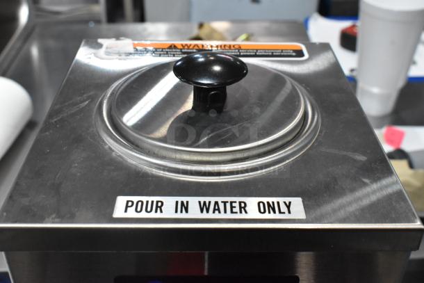 Brand new 2024 Bunn OHW 80 oz. stainless steel pourover hot water machine, 120 volts, with "Pour In Water Only" label.