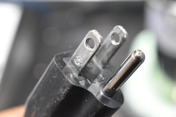 Close-up of the power plug for the AvaMix 928RDM1SF Retro Seafoam Single Spindle Drink Mixer, showing prongs and connector details.