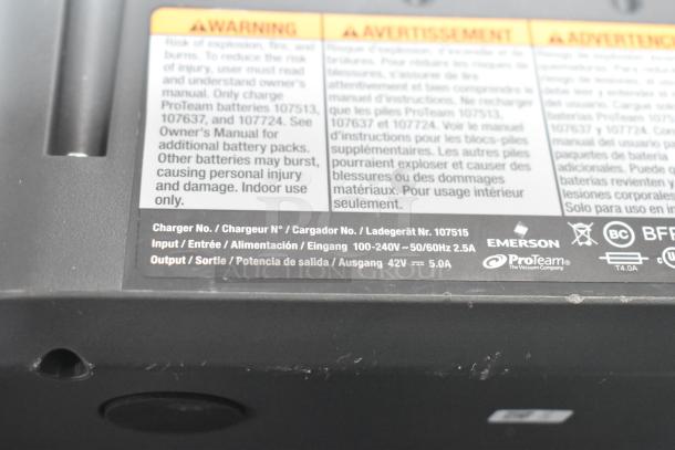 BRAND NEW SCRATCH AND DENT ProTeam 1076420 Backpack Vacuum Cleaner, features warnings, charger specifications, 100-240V input.