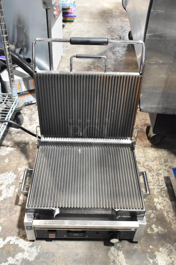 Brand new Waring WPG250T Panini Grill with grooved top, smooth bottom surface, and timer; 14.5"x11" cooking area.