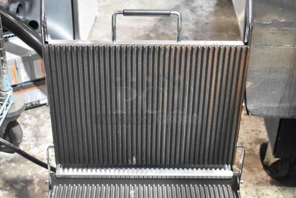 Brand new Waring WPG250T Panini Grill with grooved top, smooth bottom, 14.5" x 11" surface; minor scratches.