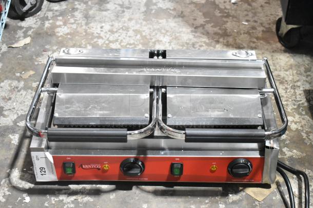 Brand new Avantco 177PG400GS commercial dual panini grill; grooved top, smooth bottom, 19 5/8" x 9 1/8" surface.