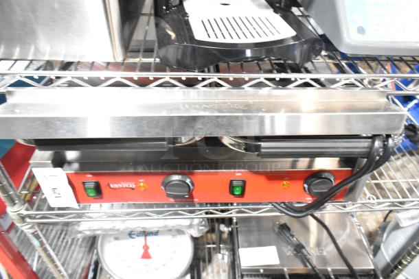 BRAND NEW Avantco 177PG400GS Commercial Dual Panini Grill with grooved top, smooth bottom, 19 5/8" x 9 1/8" surface.