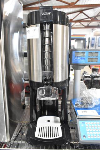 BRAND NEW Fetco LGD-20 Luxus 2 Gallon Stainless Steel Coffee Dispenser with Stand. Slight scratch and dent.