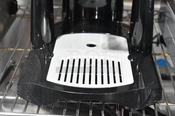 BRAND NEW Fetco LGD-20 Luxus 2 Gallon Stainless Steel Coffee Dispenser with Stand. Minor scratches visible.
