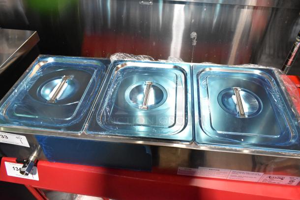 Brand new 2023 Avantco 177BMFW3 36" electric bain marie food warmer with 3 half-size wells, still in protective wrap.