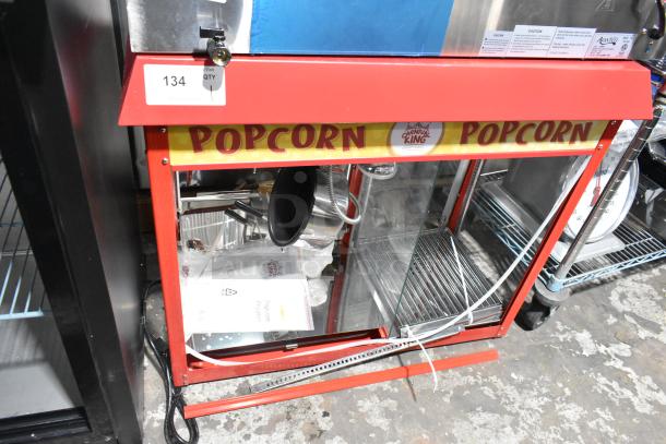 Carnival King 382PMW17R Popcorn Machine, brand new with damaged back glass panel, 120V, 1 phase, includes warming merchandiser.
