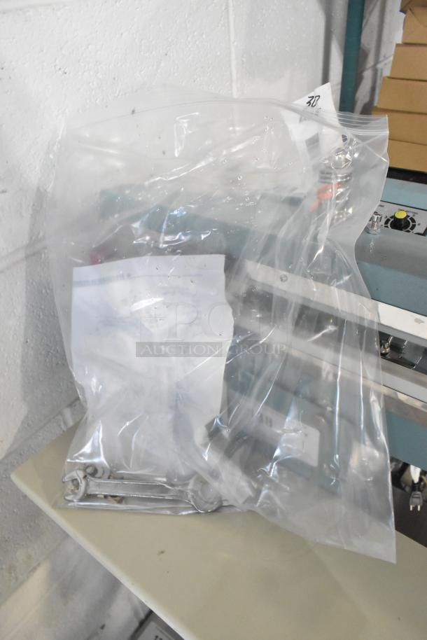 Brand new 2025 Galaxy PFS-450 metal foot-operated impulse bag sealer with timer, 110V, in plastic packaging, minor scratches noted.