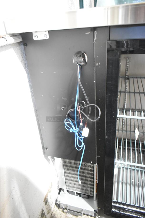 Brand new Avantco 178UBB72SMC 73" refrigerator, black, counter height, missing doors, visible wiring, LED lighting, 115V, 1 phase.