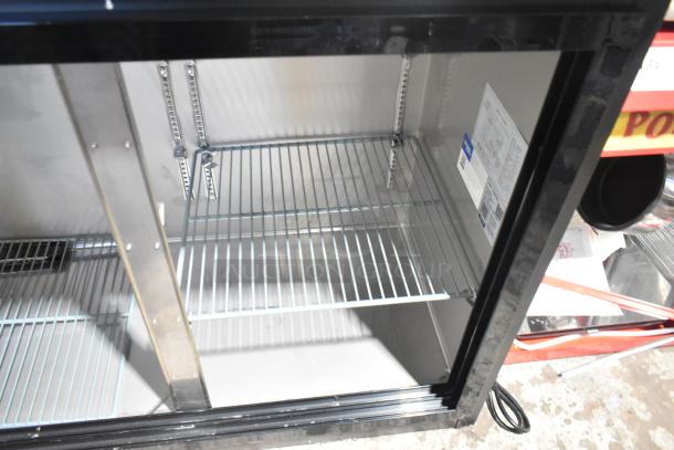 BRAND NEW Avantco 178UBB72SMC 73" black back bar refrigerator, missing doors. Features LED lighting. 115 Volts, 1 Phase.