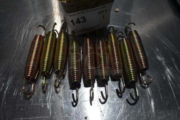 Box of metal door springs, brand new with minor scratches, hooks on each end, labeled "143" from PCI Auctions.