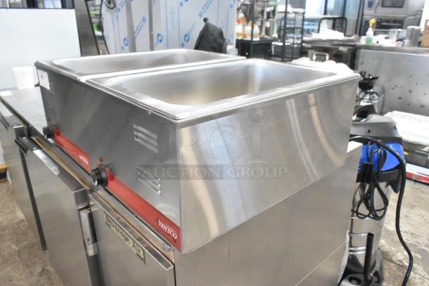 Brand new Avantco 177FW200D dual well electric countertop food warmer, 120V, with thermostatic controls, minor scratches.